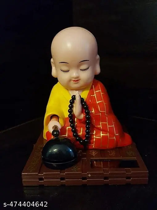 GEETA ENTERPRISES Little Cute Buddha Solar Head Shaking Monk Statue | Car, Office, Home Decorative Showpiece-9.5cm, Pack of 1 (Plastic,Multicolor) (RED)
