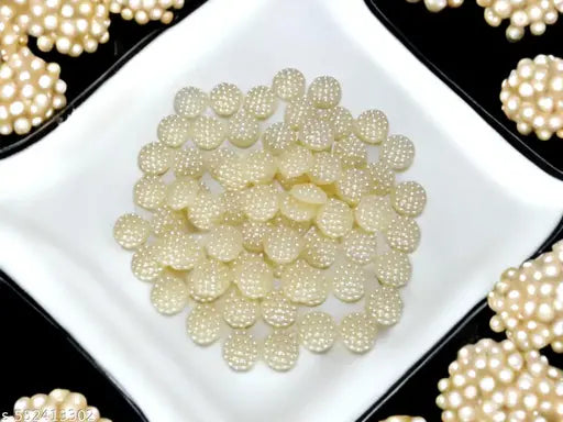 10mm sugar half round cream moti. Use for art and craft design accessories and also jwellery making accessory. 300 piece per order