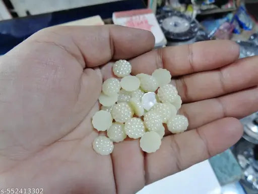 10mm sugar half round cream moti. Use for art and craft design accessories and also jwellery making accessory. 300 piece per order