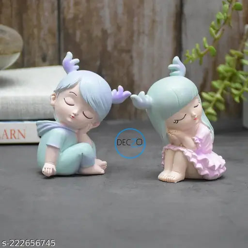 COMBO OF MINIATURE SLEEPY BOY AND GIRL RESIN SHOWPIECES