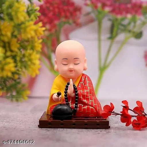 GEETA ENTERPRISES Little Cute Buddha Solar Head Shaking Monk Statue | Car, Office, Home Decorative Showpiece-9.5cm, Pack of 1 (Plastic,Multicolor) (RED)