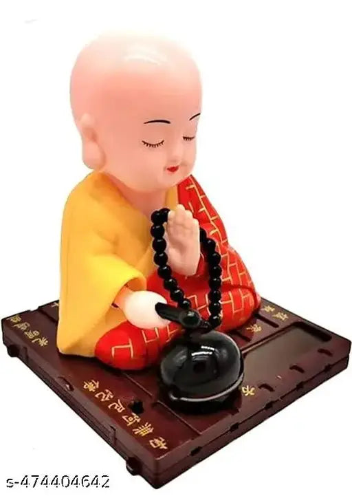 GEETA ENTERPRISES Little Cute Buddha Solar Head Shaking Monk Statue | Car, Office, Home Decorative Showpiece-9.5cm, Pack of 1 (Plastic,Multicolor) (RED)