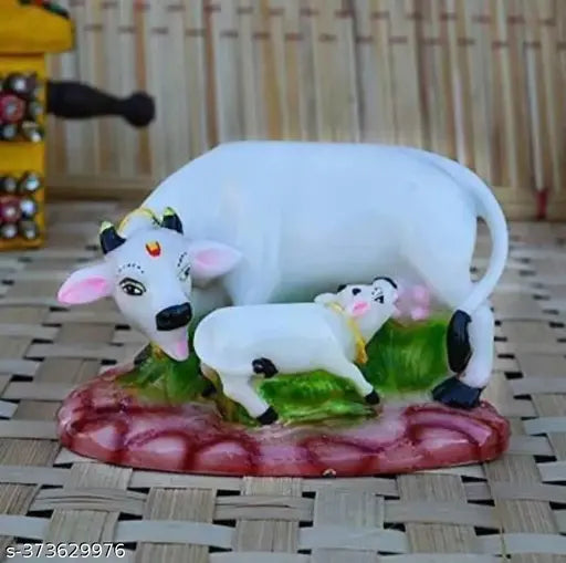 Kamdhenu Kamadhenu Idol Murti Statue Cow with Calf Statue is made of fine grade Polyresin.