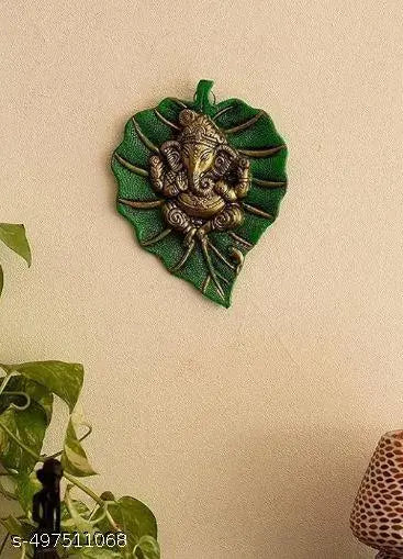 Beautiful Lord Ganesha on Green Leaf Metal Wall Hanging Sculpture Decorative Religious Showpiece for Home Wall Decor, Pooja Room, Temple & House Warming Gift