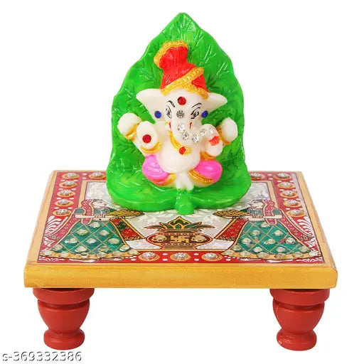 Marble & Polyresin Leaf Pagri Ganesh Stone Desin with Marble Chowki Stand Artistic Elegance for Every Occasion.Divine Aura: The presence of Lord Ganesh, adorned with a leaf pagri, exudes a divine aura, making it an ideal addition to car dashboards, office