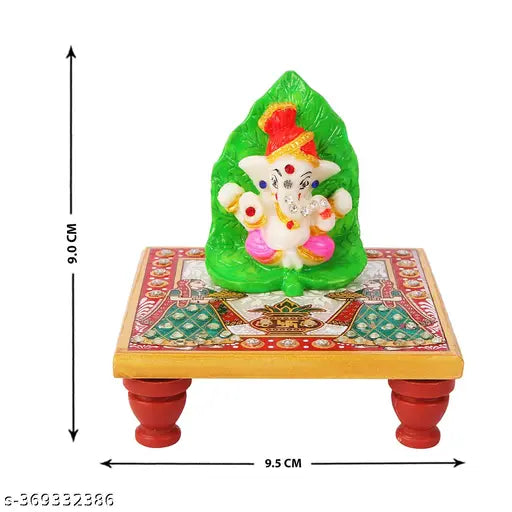 Marble & Polyresin Leaf Pagri Ganesh Stone Desin with Marble Chowki Stand Artistic Elegance for Every Occasion.Divine Aura: The presence of Lord Ganesh, adorned with a leaf pagri, exudes a divine aura, making it an ideal addition to car dashboards, office