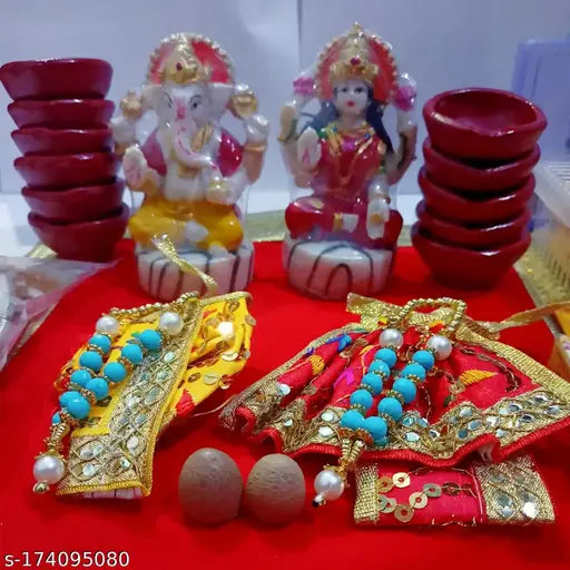 Diwali pooja kit , combo of laxmi ganesh murti (4.5 inch) , 2 supari ,  bhagvaan poshak or mala, 11 terracotta diya , 50 multicolor cotton wicks , 20 ghee wicks , 1 aasan, 10 pc small upla, roli,  aarti book, or 50 gram loban
