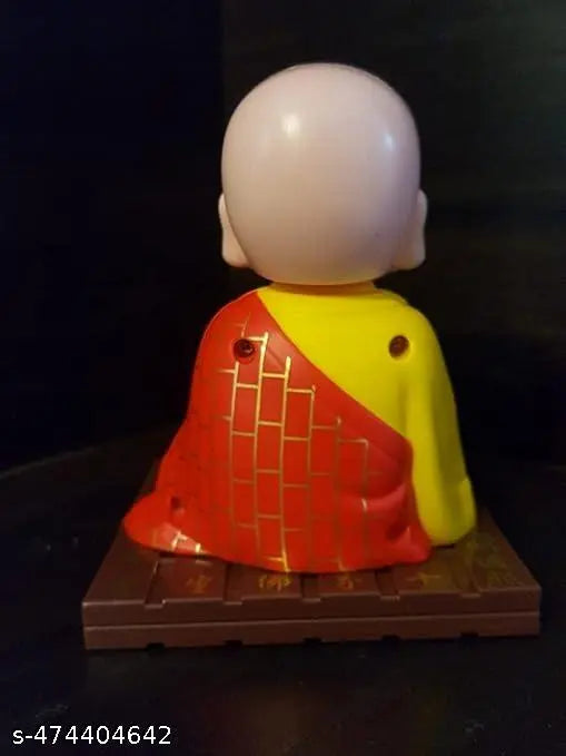 GEETA ENTERPRISES Little Cute Buddha Solar Head Shaking Monk Statue | Car, Office, Home Decorative Showpiece-9.5cm, Pack of 1 (Plastic,Multicolor) (RED)